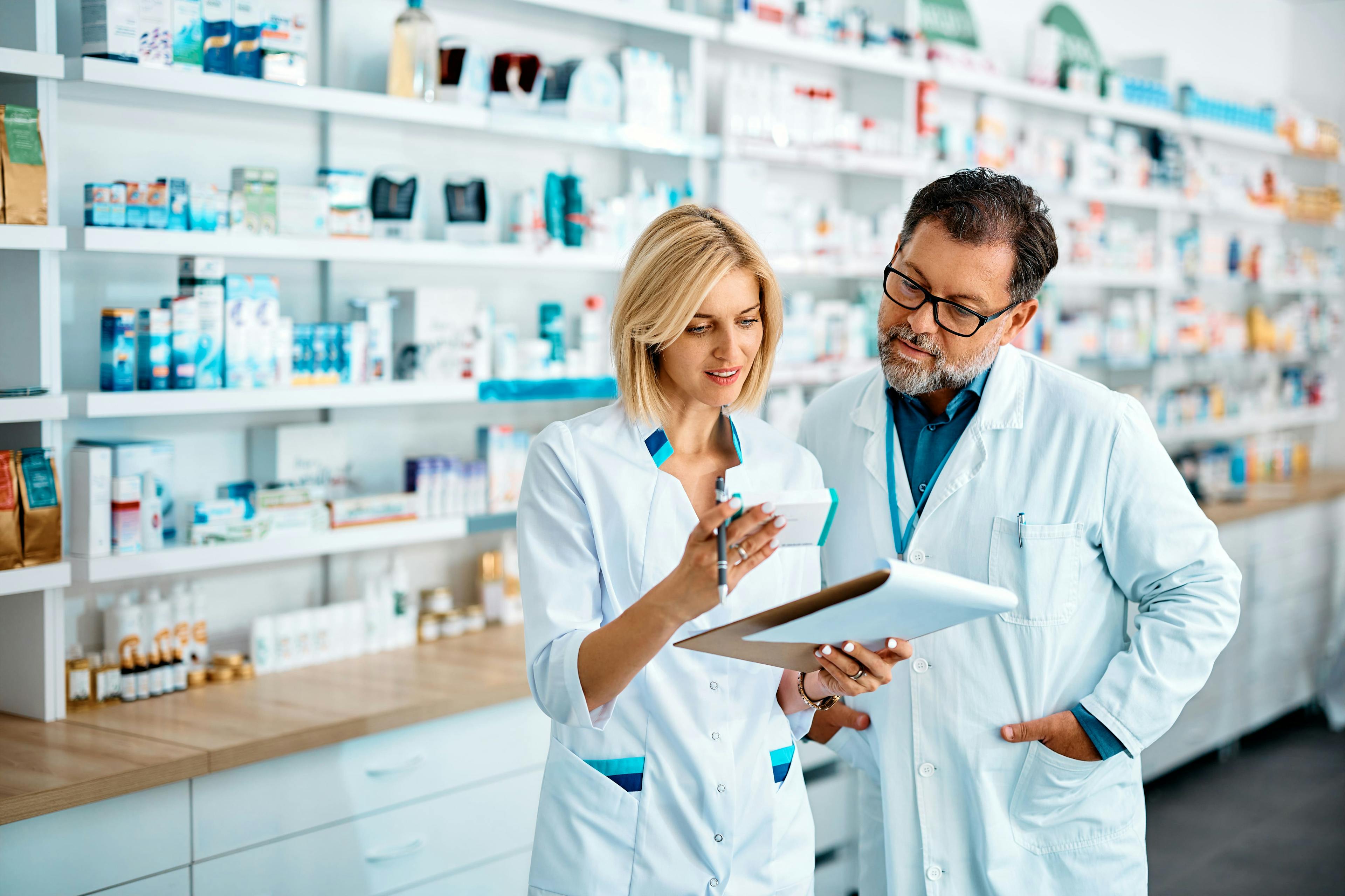 two pharmacist checking medication